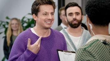 The Charlie Puth Show TV Show screenshot 2: Puth and Mike O’Donnell talk to someone with a clipboard. Charlie wears a purple sweater.