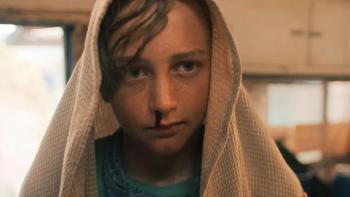 The Chosen One TV show screenshot 1: Jodie is shown in close-up, with a brown blanket over his head. His nose is bleeding. 