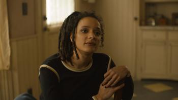 The Crowded Room: Sasha Lane sits at a kitchen table.