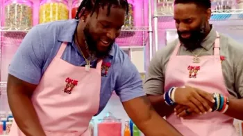 The Cupcake Guys TV Show: two black former NFL players, Michael Griffin and Brian Orakpo, wear pink aprons in front of a cupcake display