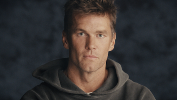 The Dynasty: New England Patriots screenshot 1: Tom Brady in dark grey sweater.