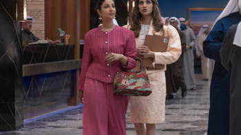 The Exchange TV show: Munira is arm and arm with Farida as she shows her around the trade floor.