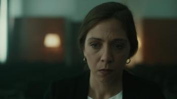 Barbara Chichiarelli sits in a dark room.