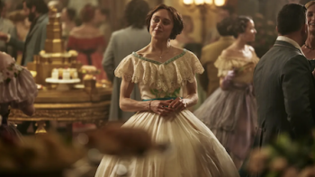 The Gray House TV show screenshot 1: Elizabeth Van Lewen in white dress at party. 