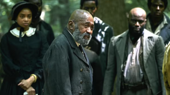 The Gray House TV show screenshot 3: Isham Worthy standing among other enslaved African Americans.