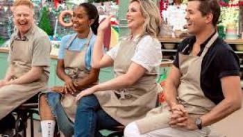 The Great American Baking Show: Celebrity Summer TV show screenshot #1: celebrity contestants sit on stools, wearing aprons