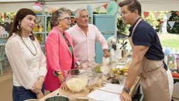 The Great American Baking Show: Celebrity Summer TV show screenshot #2: a celebrity contestant talks to the judges and host