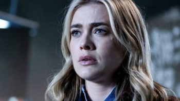 The Hunting Party TV show screenshot 1: Rebecca “Bex” Henderson looks at something carefully.