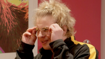 The Joe Schmo Show TV screenshot 3: Jonathan Lipnicki puts on round metal rimmed glasses.