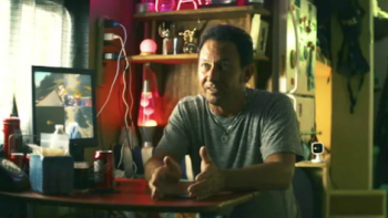 The Kings of Tupelo screenshot 1: Paul Kevin Curtis sits in his mobile home. 