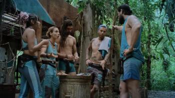 A group of men and women talking in the jungle