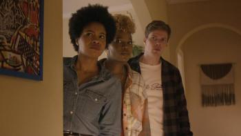 The Other Black Girl TV show screenshot 1: Sinclair Daniel, Brittany Adebumola and Hunter Parrish are concerned as they look around a corner. 