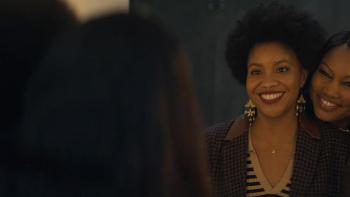 The Other Black Girl TV show screenshot 2: Garcelle Beauvais leans on Sinclair Daniel, smiling at her. 