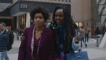 The Other Black Girl TV show screenshot 3: Ashleigh Murray smiles as she puts her arm around Sinclair Murray. 