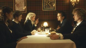 (From Left to Right) Kaia Gerber, Igby Rigney, Hayes Werner, Homer Gere, and Graham Campbell sit at a restaurant table.