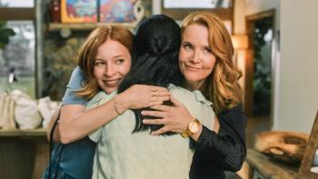 The Spencer Sisters TV show screenshot: A mother and daughter are shown hugging a woman together.