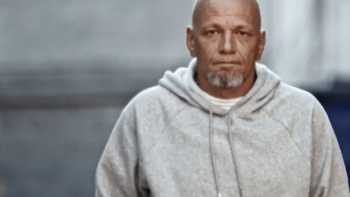 The Takedown: American Aryans TV show  screenshot 3: Bald male informant with white goatee in gray shirtshirt. 