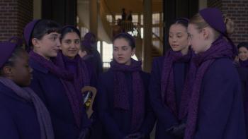 The Testaments TV show screenshot: the girls stand outside looking serious