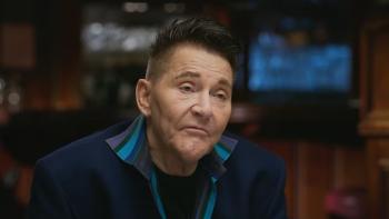 The Wonderland Massacre TV show screenshot 3: Scott Thorson sits in an interview. He wears a blue jacket.