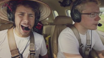 The Worst Trip Around the World TV show screenshot 1: Juanpa Zurita sitting in airborne plane next to Matt Guthmiller.