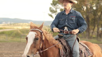 The Wranglers TV show screenshot 1: A staffer on horseback. 