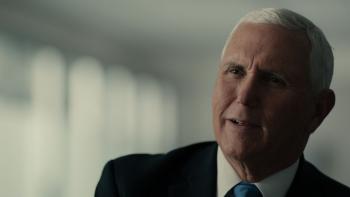 The American Experiment TV show screenshot: Mike Pence in a suit with a serious expression indoors.