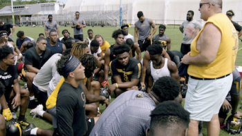 The Cost of Winning TV Show: Coach Poggi talks to students during practice