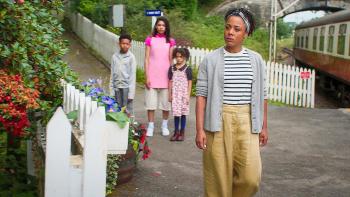 The Primrose Railway Children: Mom walks in front of kids Phoebe, Perry and Becks in a bucolic setting of a heritage railway.