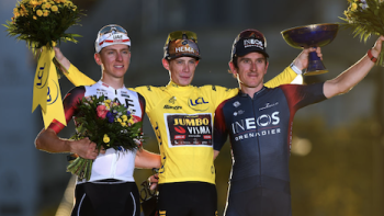 Tour de France: Unchained TV show screenshot 2: Tadej Pogačar in white,  Jonas Vingegaard in the yellow jersey, and Geraint Thomas in blue stand on winners podium.