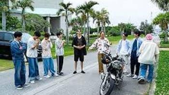 Traveling with Snow Man TV show screenshot #1: the band stands around a motorcycle