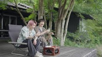 Traveling with Snow Man TV show screenshot #3: two band members sit outside and laugh 