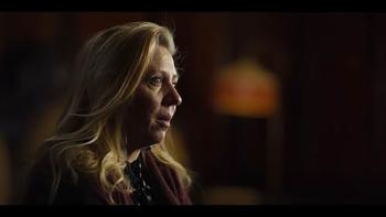  True Haunting TV show screenshot 2: The real-life April Miller is pictured in profile while speaking, she has long blonde hair