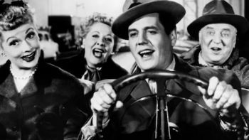 TV We Love TV show screenshot 2: A black and white photo of Lucy and Ricky Ricardo and Fred and Ethel Mertze in car