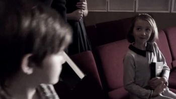 Twisted Love screenshot 2: A little boy looks right at a little girl. 