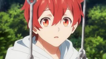 UniteUp! TV Show: A man with red hair sitting on a swing at a park looking surprised.