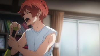 UniteUp! TV Show: A man with red hair singing in his bedroom, using a baseball bat as a pretend microphone.