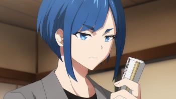 UniteUp! TV Show: A man with blue hair dressed in a suit, holding a paper fan and looking unamused.