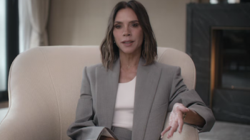 Victoria Beckham TV show screenshot 1: Victoria Beckham sitting in white chair with white shirt and gray jacket