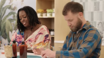 Virgins TV show screenshot 2: Rasha Newkirk sits at counter with man in plaid shirt. 