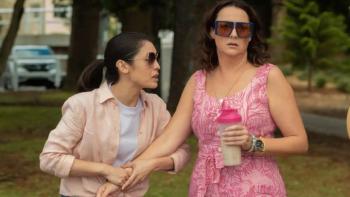 Wellmania TV show: Amy and Liv are dressed up as for a party; Liv holds a pink drink while Amy clutches one hand