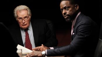 A West Wing Special TV Show: Chief of Staff Leo McGarry and President Bartlett seated at a conference table, looking at a speaker in front of them, off screen 