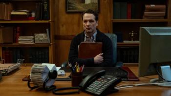 Widow's Bay TV show screenshot 1: the mayor (Matthew Rhys) sits at his desk