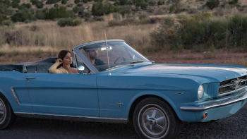 Wildnerness screenshot 1: Liv and Will driving in a blue Mustang. 
