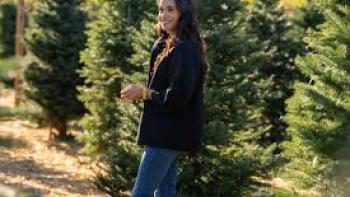 With Love, Meghan Holiday Celebration TV show screenshot #2: Meghan walks among Christmas trees outdoors