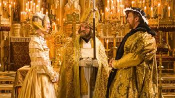 Wolf Hall: The Mirror & the Light TV show screenshot 3: King Henry VIII and Anne of Cleves face each other on an elaborate wedding altar. 
