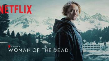 Netflix Series Woman of the dead printed over the image of a woman with short blond hair looking over her shoulder at the camera in front of mountains
