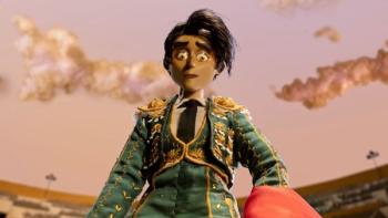 Women Wearing Shoulder Pads TV show screenshot 2: Espada, wearing her bullfighting costume, stands in a stadium gazing down at an unseen creature.