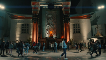 Wonder Man: Simon is shown walking across a large, elaborate movie set with giant pillars; many other people are working on the set