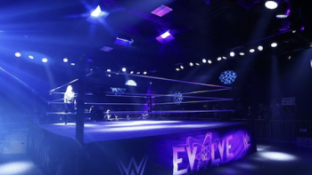 WWE Evolve TV show screenshot 1: Wrestling ring in purple light. 