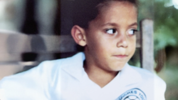 You Don’t Know Where I’m From, Dawg TV show screenshot 1: Clint Dempsey as a child wearing a white school shirt.